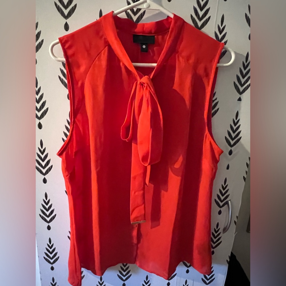 Red sleeveless blouse with tie